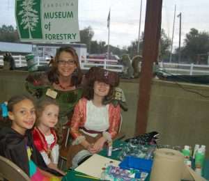 Mother Nature and her helpers at the face painting table.